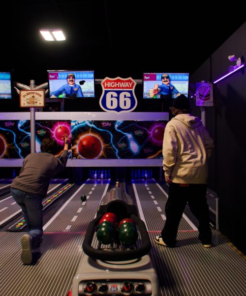 Players bowling on the Route 66 mini bowling lanes at Boardwalk Entertainment Centre